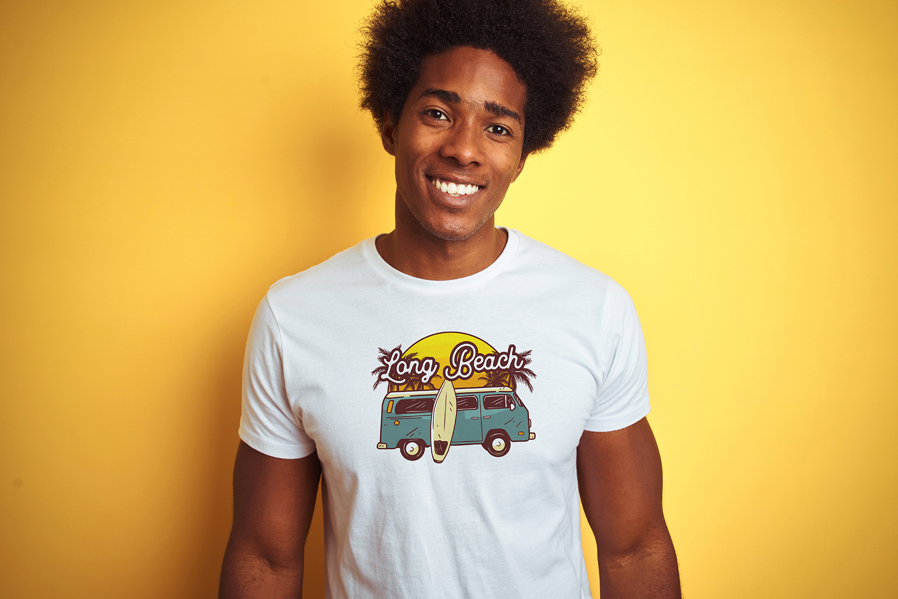 Model wearing a Long Beach graphic tee on yellow backdrop