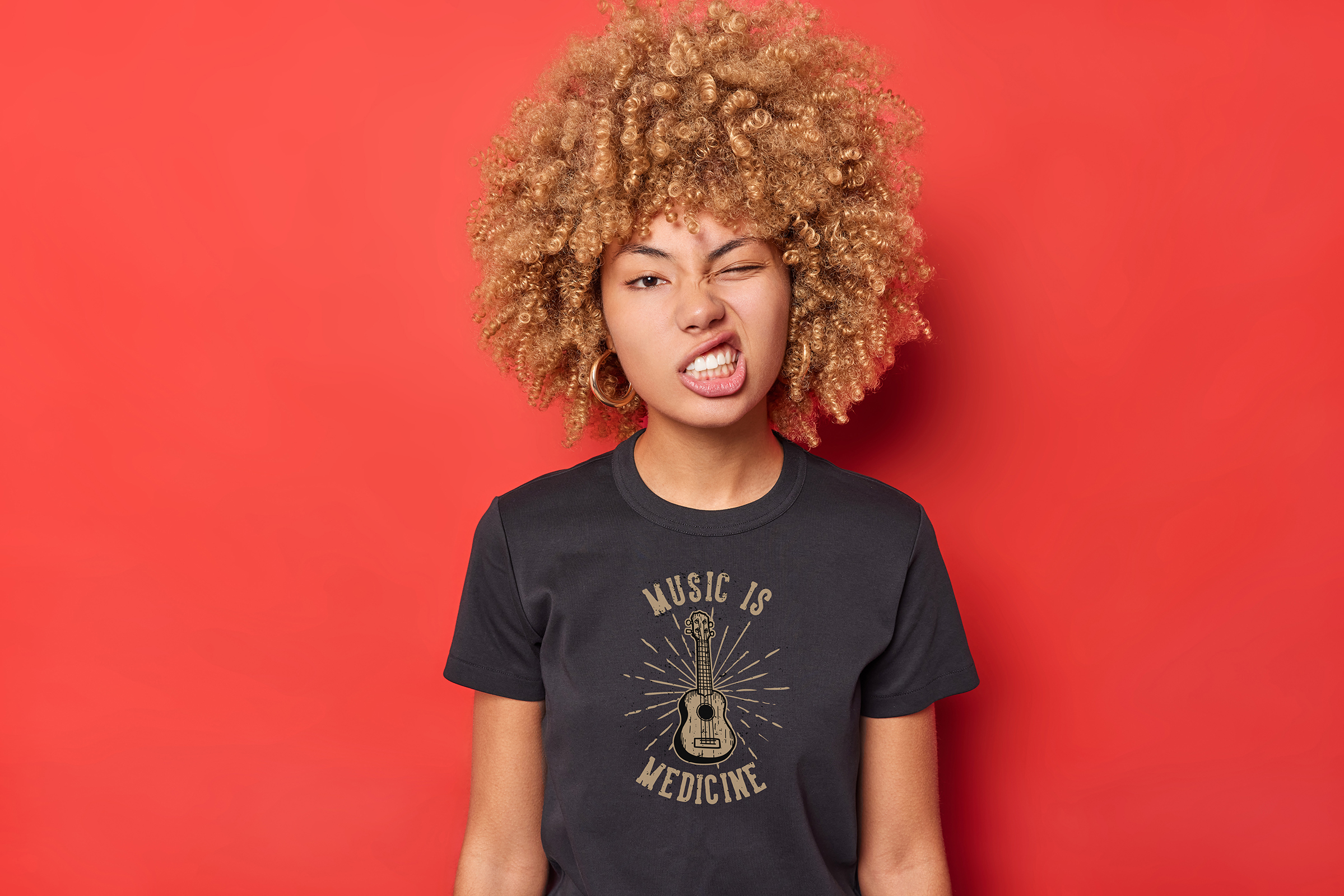 Model wearing a black Chaktee51 Music Is Medicine t-shirt
